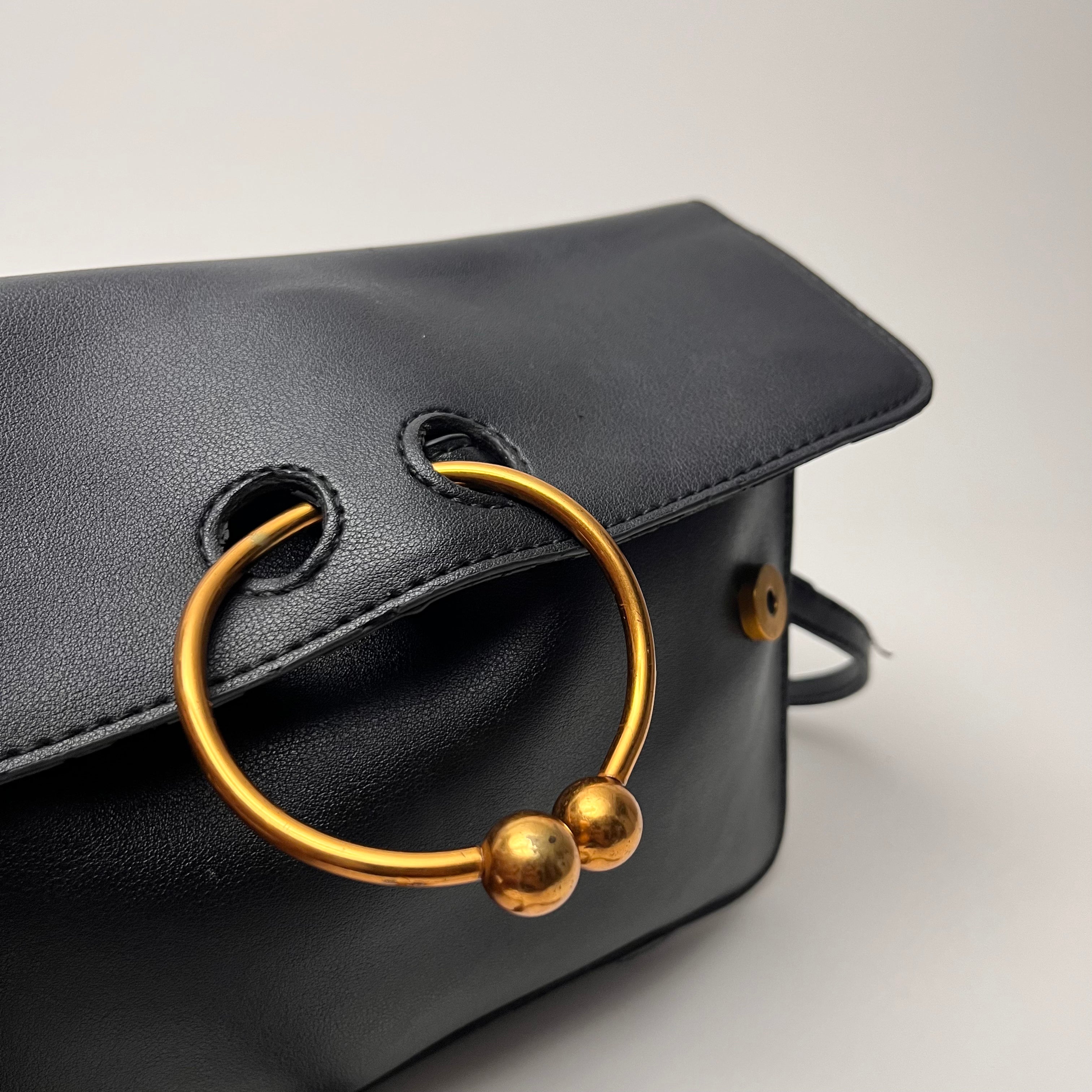 Pierce Ring Clutch Crossbody